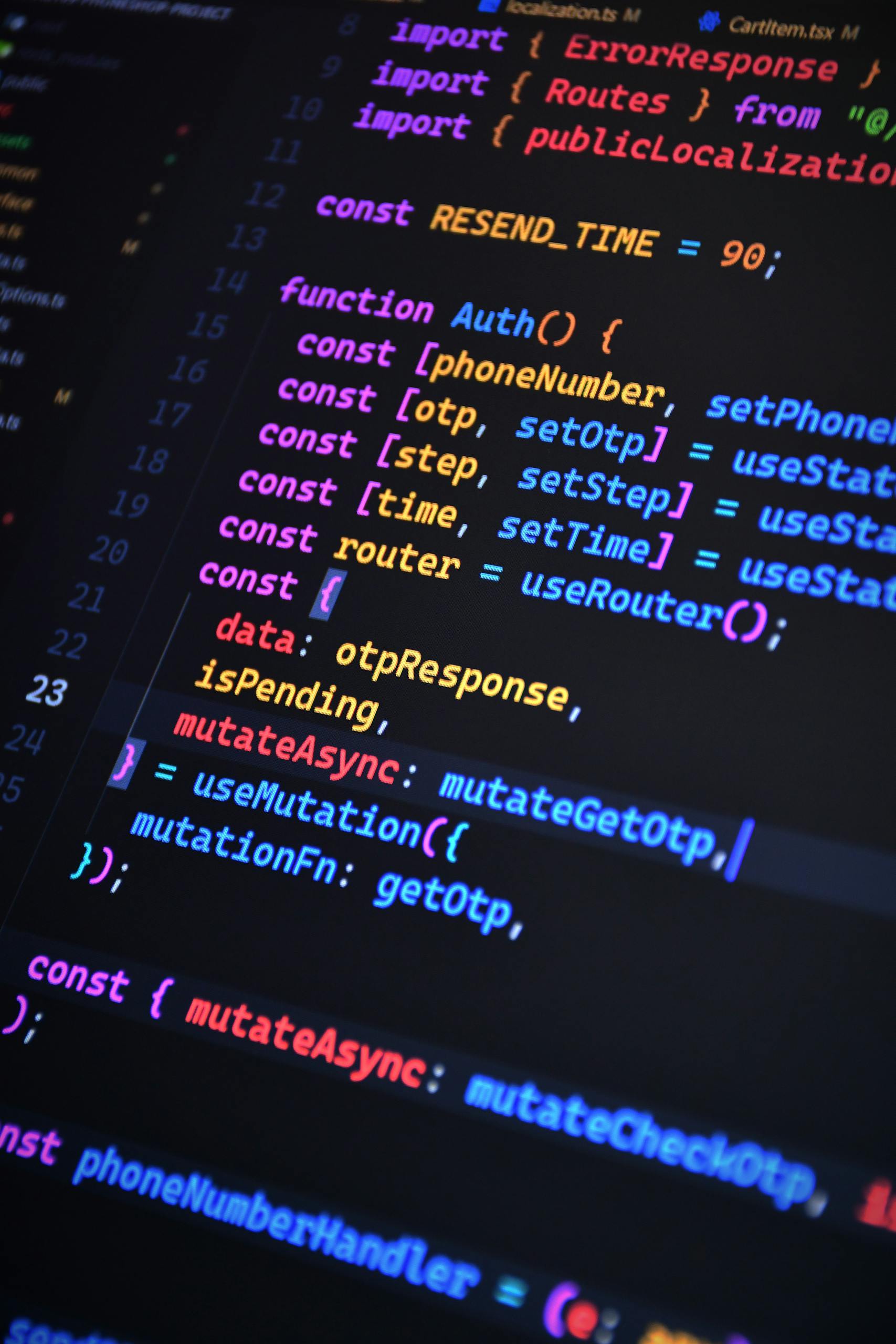 Close-up of vibrant JavaScript code for web development with ReactJS and Tailwind CSS.